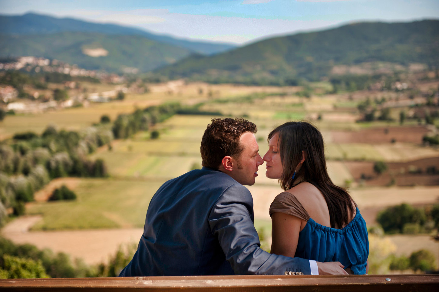 Wedding couple kissing on a hillside, MadlyWed wedding photography
